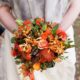 burnt orange and green wedding bouquet, roses, protea, calla lily, Viburnum florist, Prineton, NJ wedding photographer.
