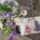 pink and dark purple wedding bouquet at base of tree, pink and white roses, dark purple queen anne's lace, 20's flapper drawing post card, Opalia florist, Frankie's 457 Spuntino, Brooklyn, NY wedding photographer.