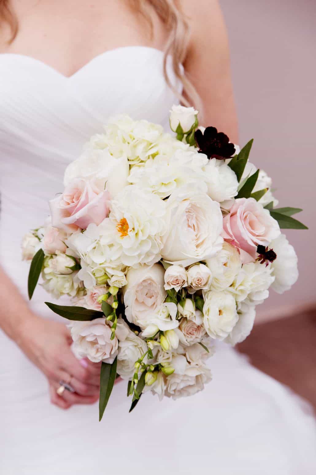 Bride Holds Large Pale Pink And White Wedding Bouquet With Dark Green Leaf Accents Roses Zinnias Hydrangea Kyo Morishima Photography