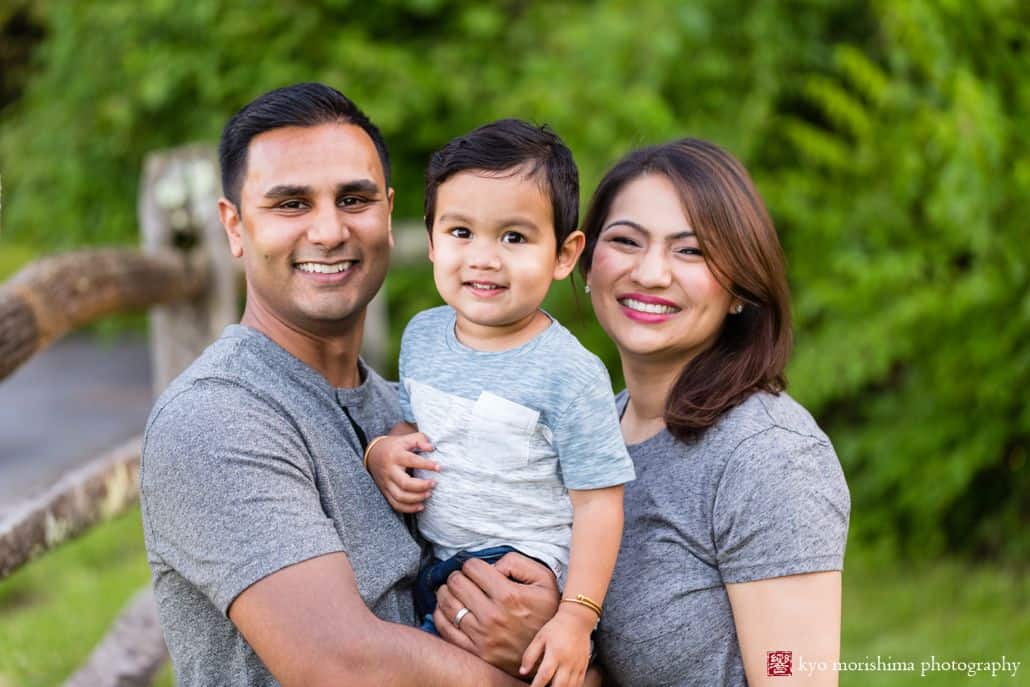 Princeton family portrait photographer: an Indian-American family poses during an outdoor photo shoot at Battlefield Park