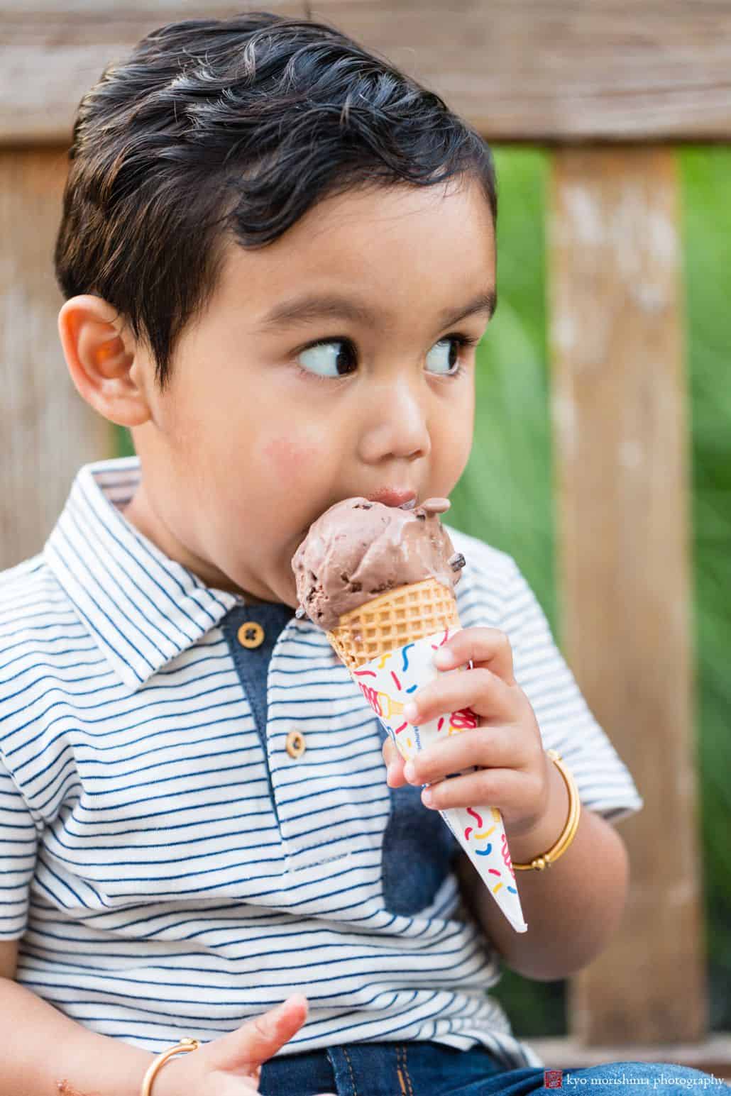Enjoying a chocolate ice cream cone from Halo Farm: candid shot by Princeton kids photographer Kyo Morishima