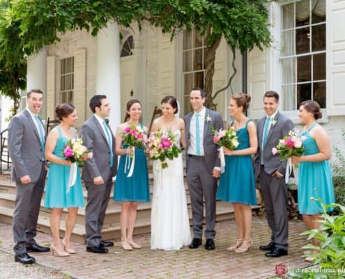 Morven House wedding party portrait with Chinese wisteria draped across porch in the background