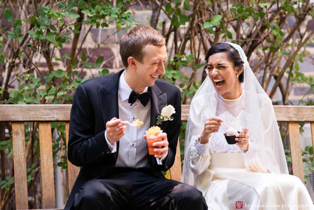 Bride and groom sit on a bench in Palmer Square and laugh ast they eat Bent Spoon ice cream