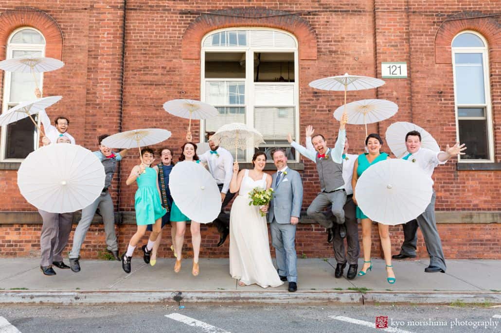 Playful industrial wedding party portrait at Brooklyn Navy Yard