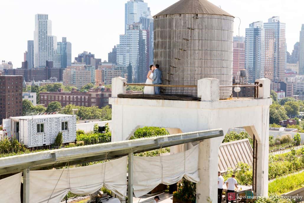 Brooklyn Grange wedding photos with watertower and cityscape in the background