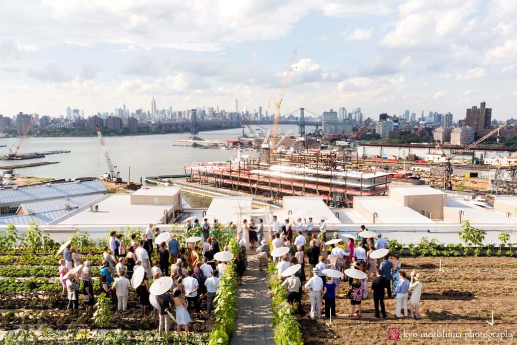 Brooklyn Grange wedding photos: ceremony overlooking the waterfront Navy Yard