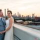 Industrial wedding portrait at the Brooklyn Grange rooftop overlooking industrial landscape