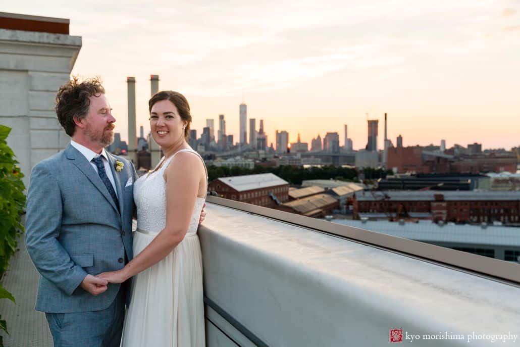 Industrial wedding portrait at the Brooklyn Grange rooftop overlooking industrial landscape