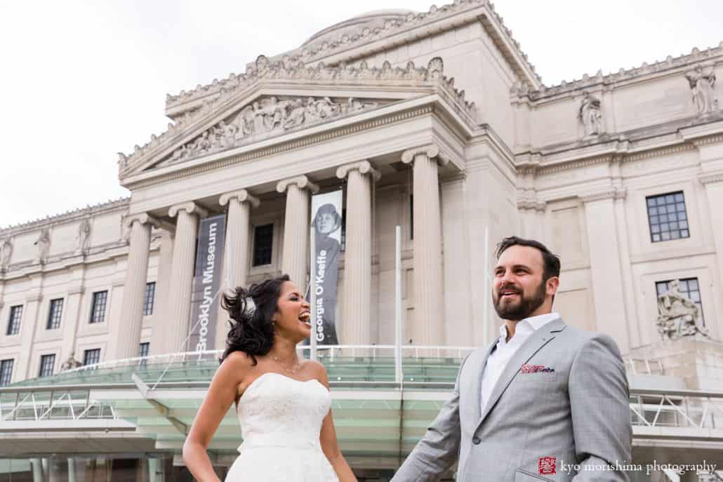 Brooklyn Museum wedding photos: portrait of bride and groom with front entrance behind them