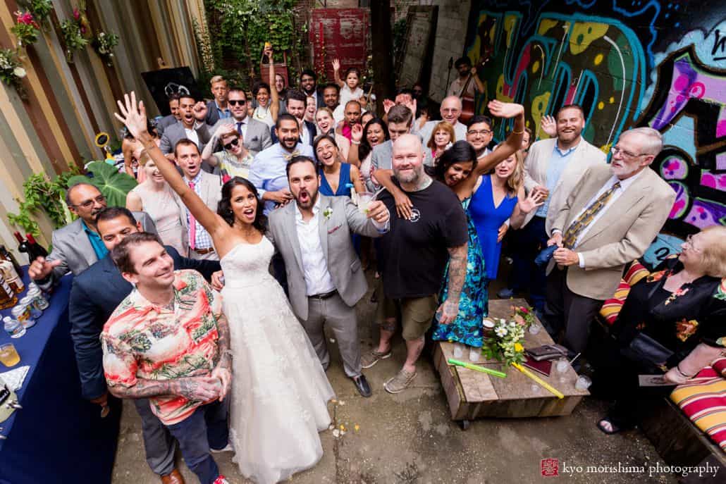 Creative wedding photo ideas: everybody is in the shot at the end of the ceremony at Electric Anvil Tattoo in Brooklyn