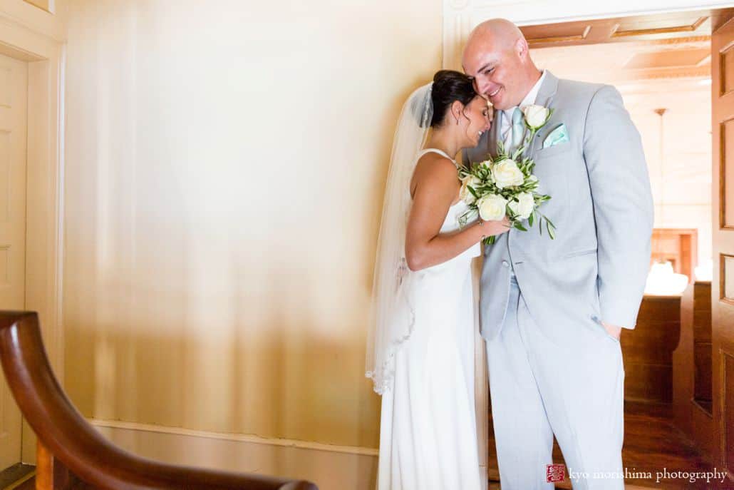 Bride rests forehead on groom's shoulder after wedding ceremony at Hunterdon County courthouse, BHLDN wedding gown, Men's Warehouse suit, pale teal tie and pocket square, The Pod Show Flowers white rose bridal bouquet, New Hope, PA wedding photographer.