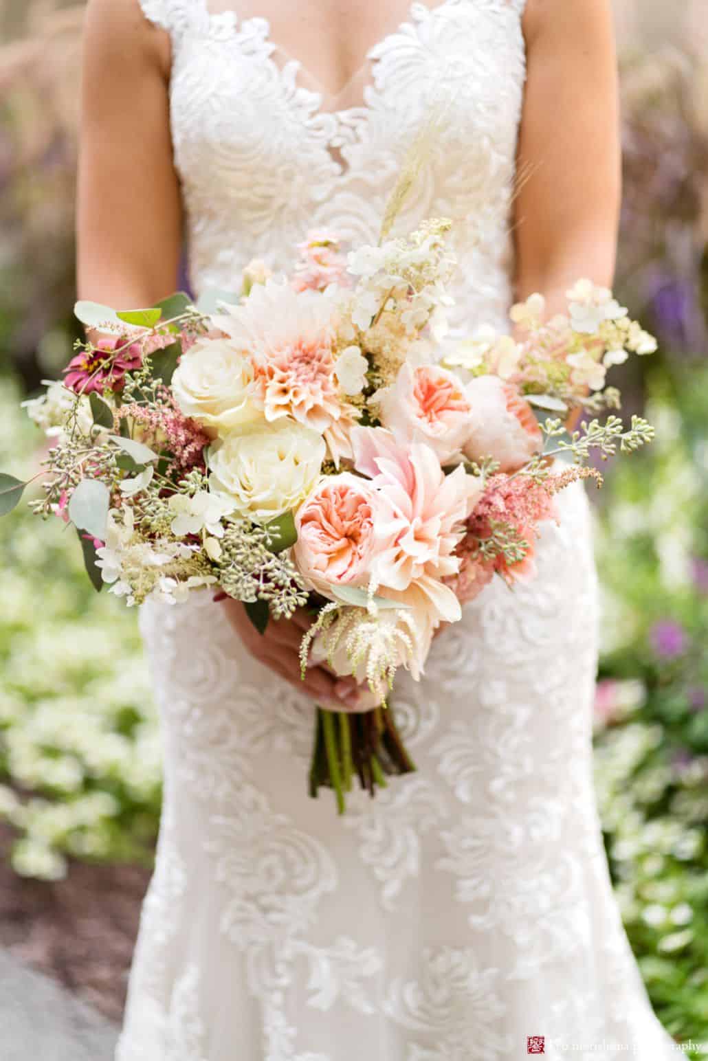 Bridal bouquet photo, white and pale pink/peach flowers with burgundy accents, roses, peonies, astilbe, eucalyptus, hydrangea, natural wedding bouquet, Fox Hill Farm Experience florist, poconos outdoor wedding photographer.