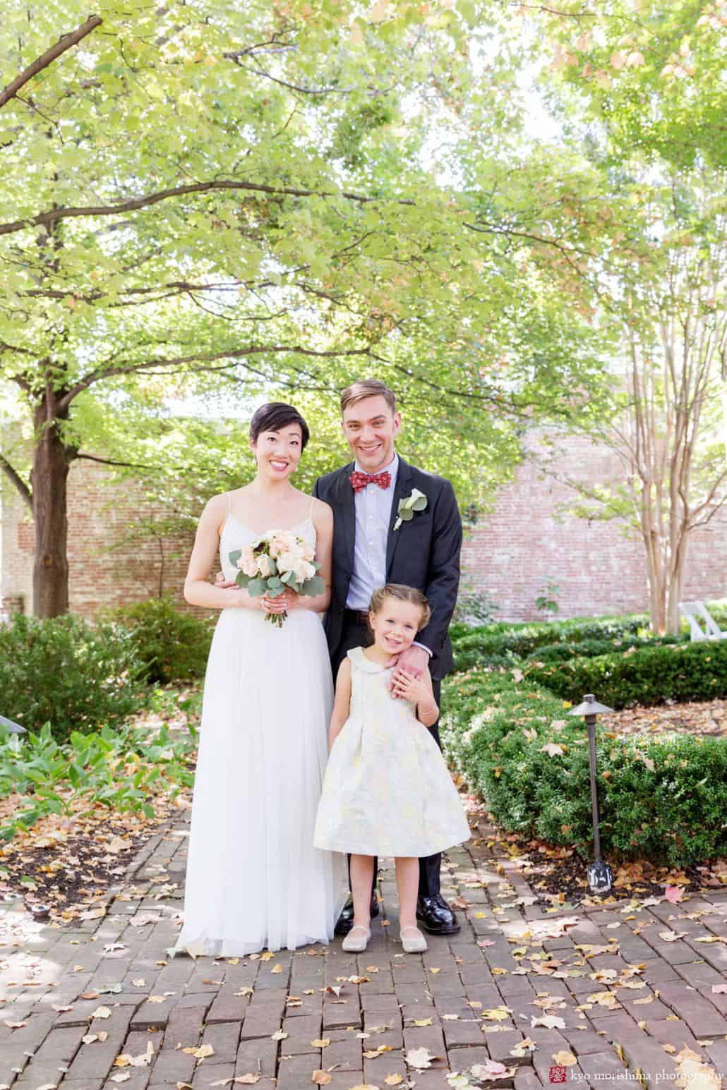 Bride groom and daughter casual and relaxed wedding portrait in Old Town Alexandria