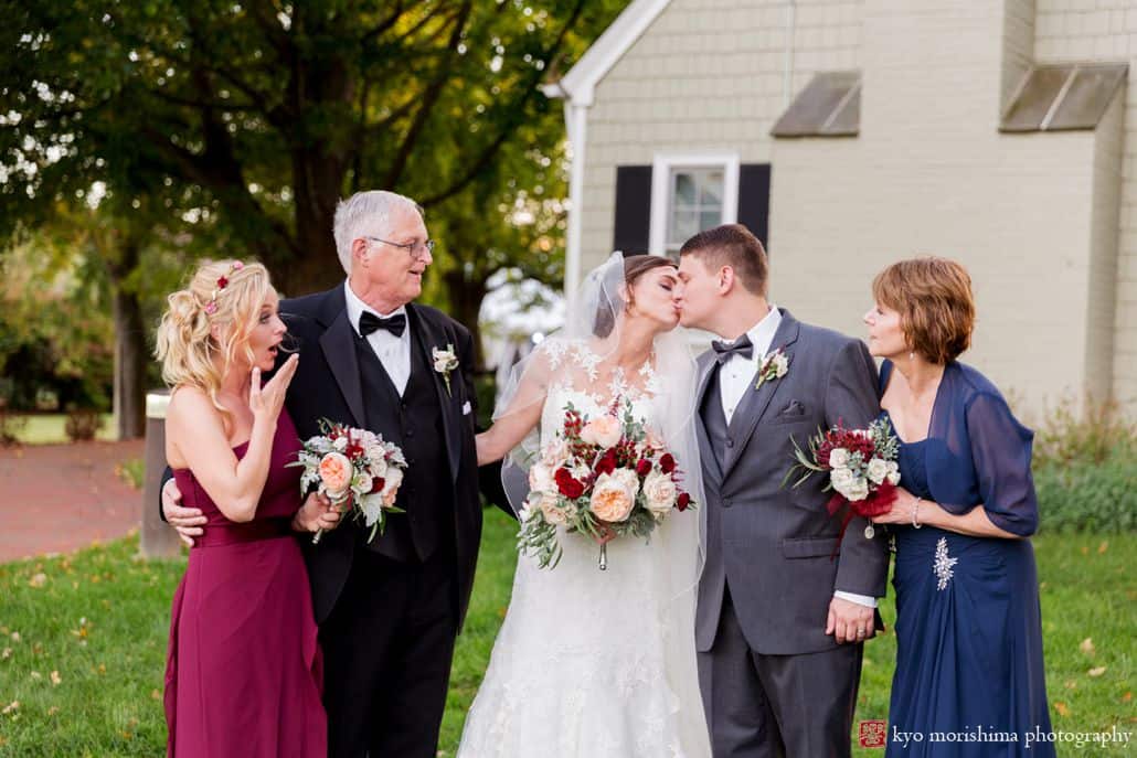 Fun wedding portrait at Laurie House as parents and bridesmaid react to bride and groom kiss, photographed by Princeton wedding photographer Kyo Morishima