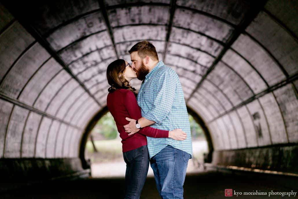 Prospect Park engagement photo: couple kisses in tunnel