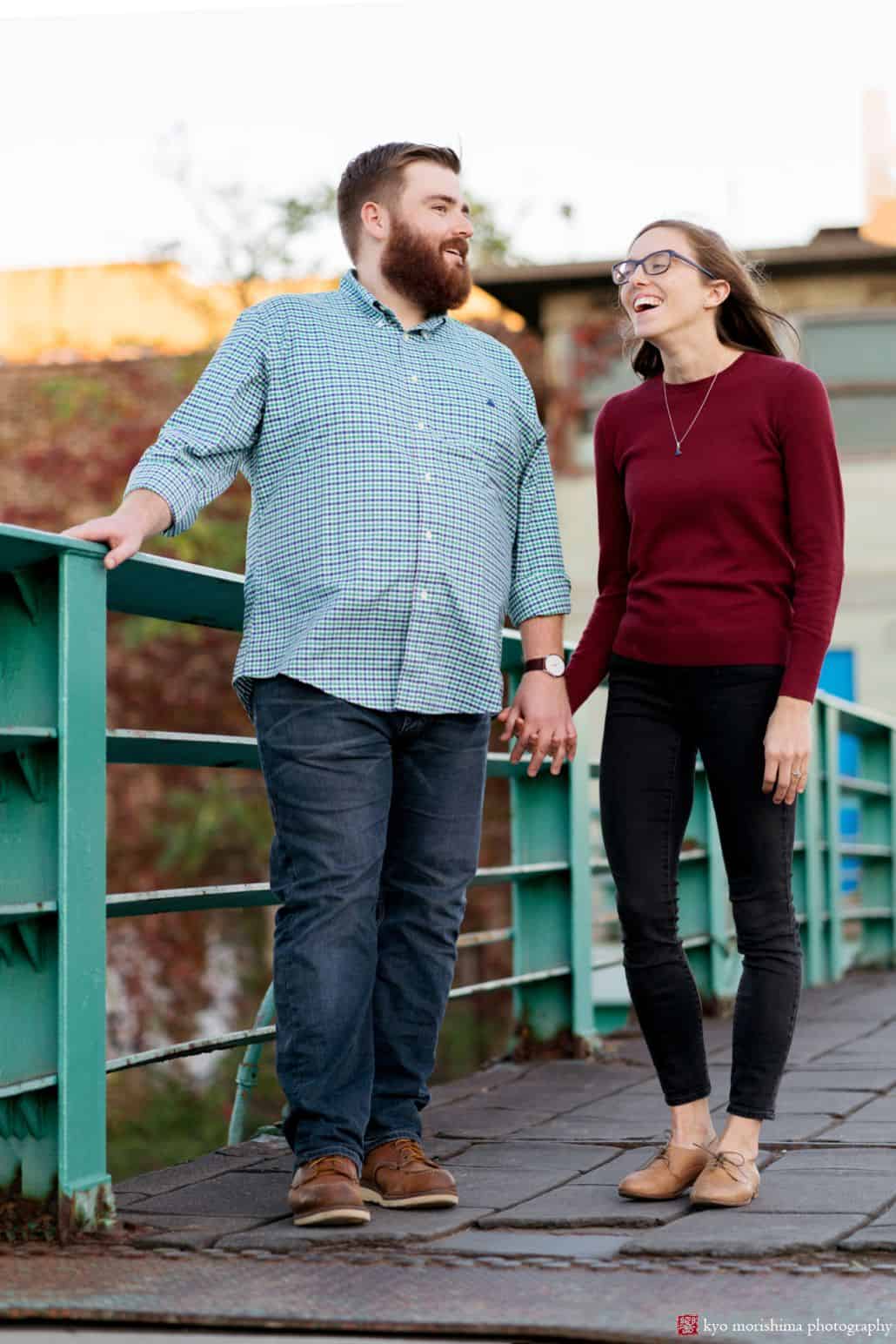 Couple laughs on bride overlooking Gowanus Canal, by Brooklyn photographer Kyo Morishima