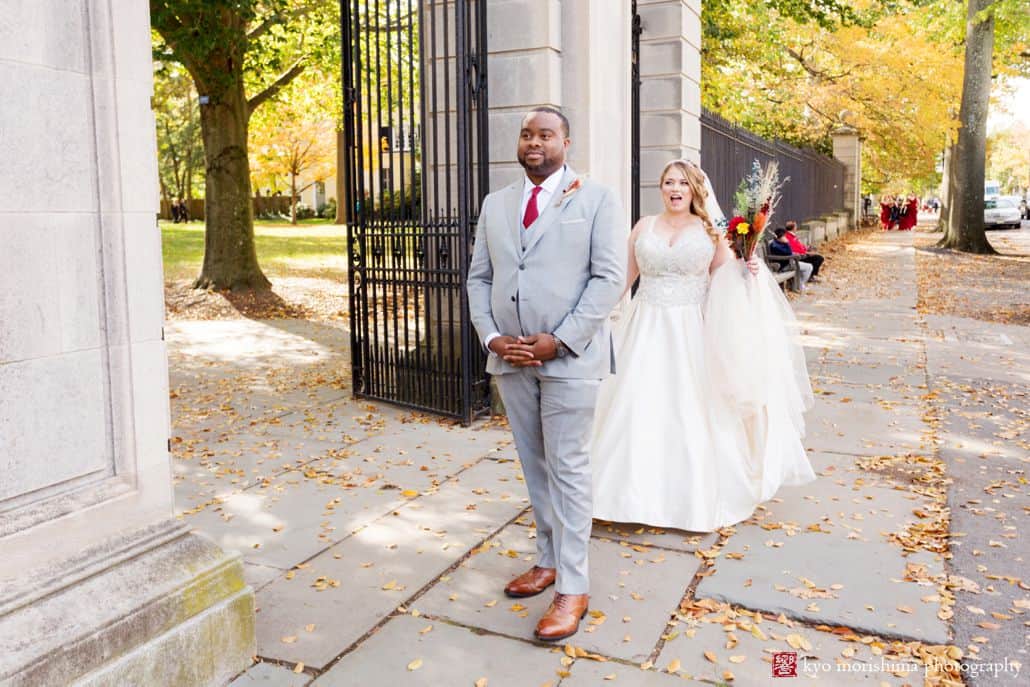 Fall first look on Nassau Street in front of Princeton University gates at the beginning of October wedding