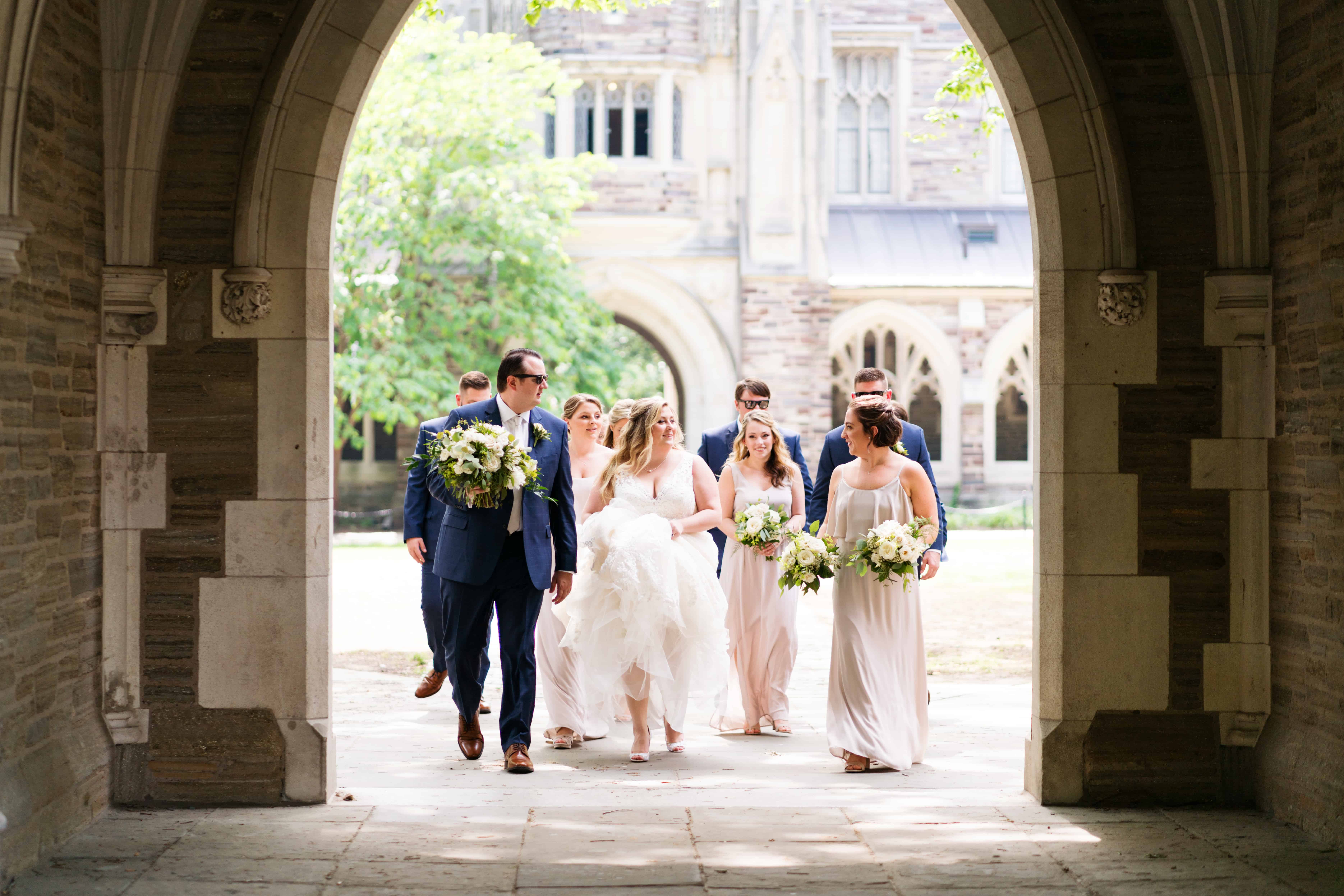 Classic Princeton University wedding photo as wedding party enters campus