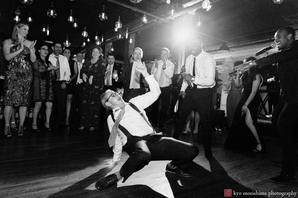 Documentary style wedding photographer NYC: guest break dances at Liberty House wedding in Red Hook, Brooklyn (music by Hank Lane band)