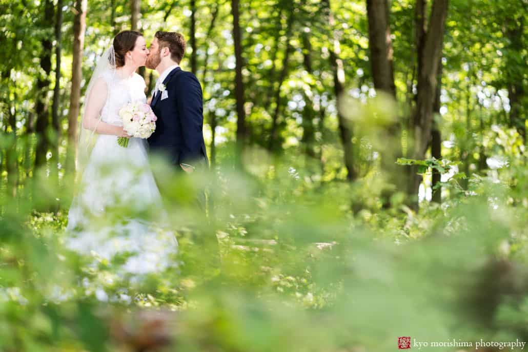 bride and groom outdoor park wedding portrait photos kissing from far away nature scenery cute wedding picture ideas Late Spring Mercer County Boathouse Princeton NJ Wedding