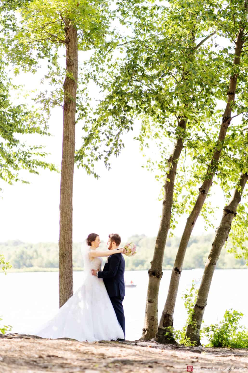 bride and groom by the water arms around each other outside wedding cute and creative wedding picture idea for outdoor wedding pictures central NJ photographer Late Spring Mercer County Boathouse Princeton NJ Wedding