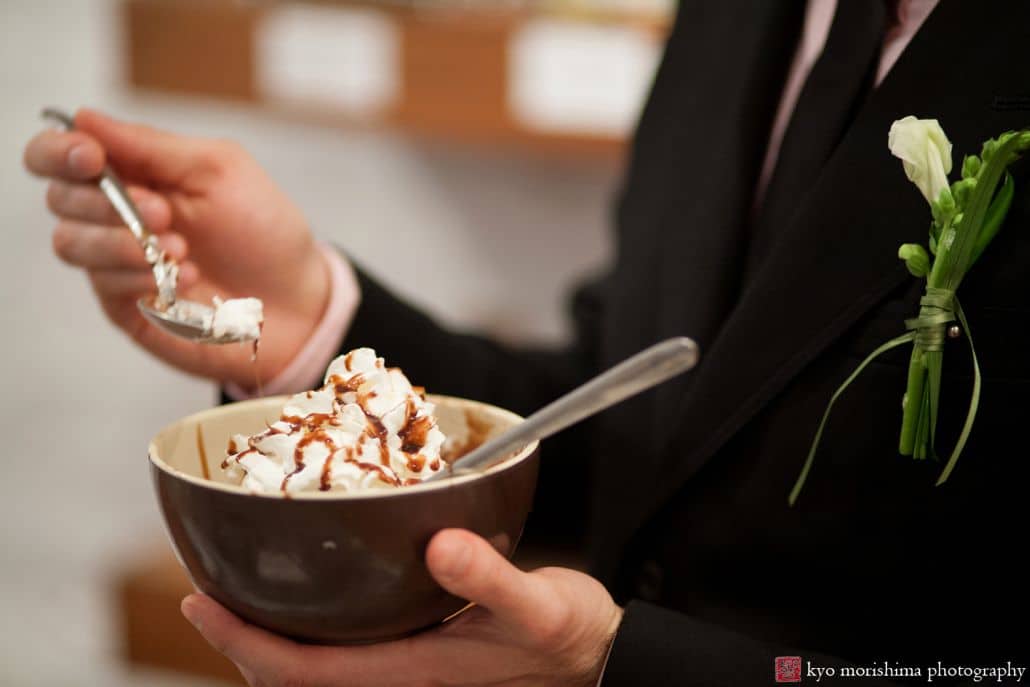 Light-hearted portrait session of a man's left hand holding a bowl of ice cream dessert and holding a spoon in his right hand, photographed by wedding photographer in central NJ Kyo Morishima.