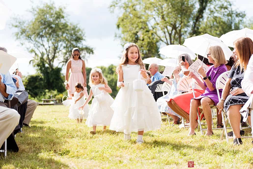 Flower girls walk down the aisle during outdoor wedding ceremony at Glenmoore Farm in Hopewell, NJ Emily’s Pennington, Adam Oded, A-1 Limo, Mary Bradley Events, Grevillea Weddings and Events, Kyo Morishima Photography, Princeton