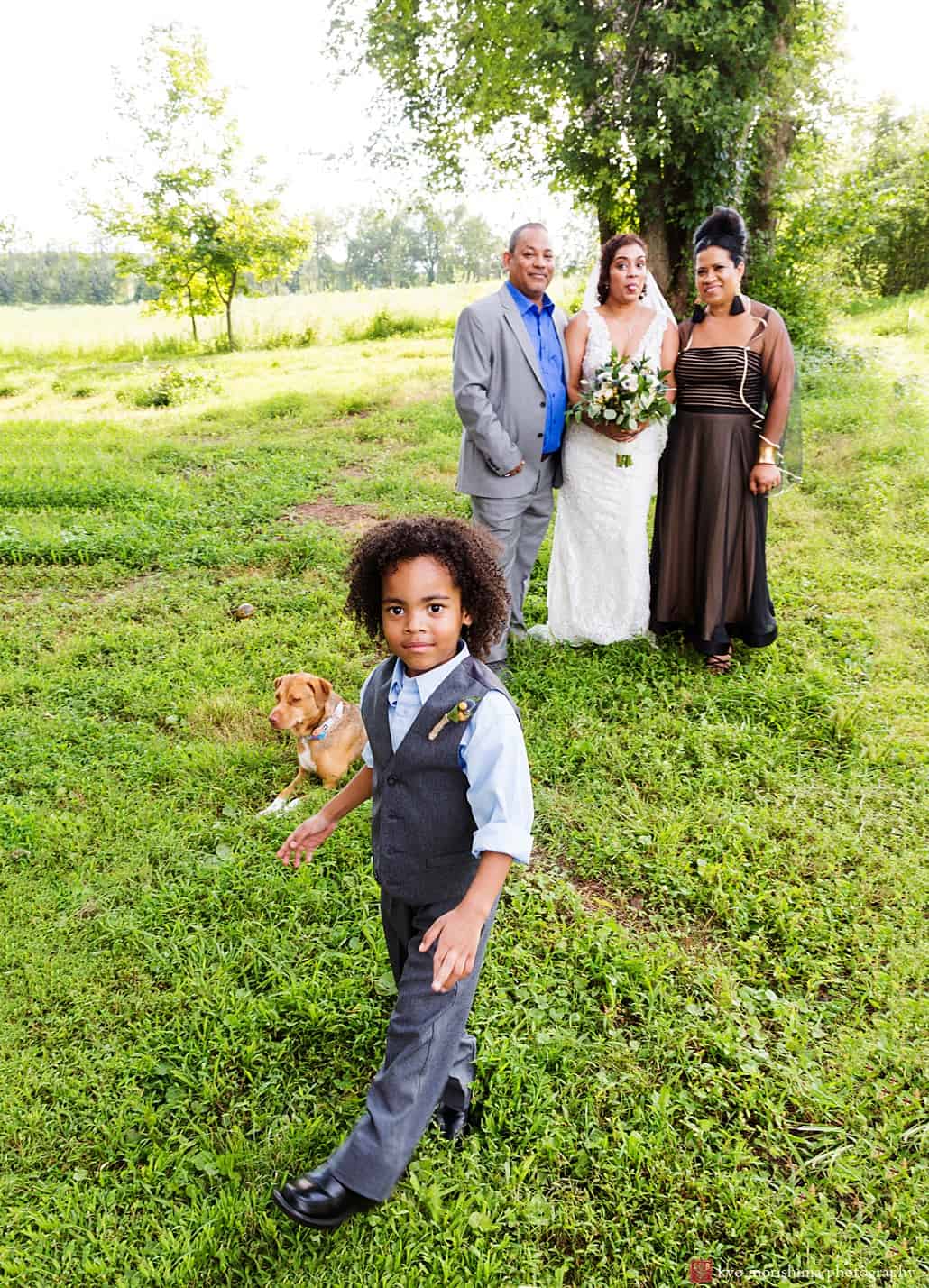 Little boy photo bombs during relaxed portrait session at Glenmoore Farm wedding in Hopewell, NJ