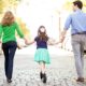 Relaxed family portraits, holding hands on a walk. NYC child and family photography.
