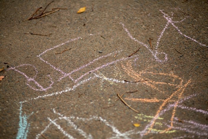 Childhood memories, chalk drawings at the park. Fun and candid child and family portraits. New Jersey family photography.