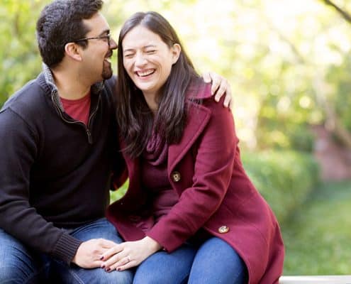 Central Park engagement photos: laughing moment on a chilly October day.