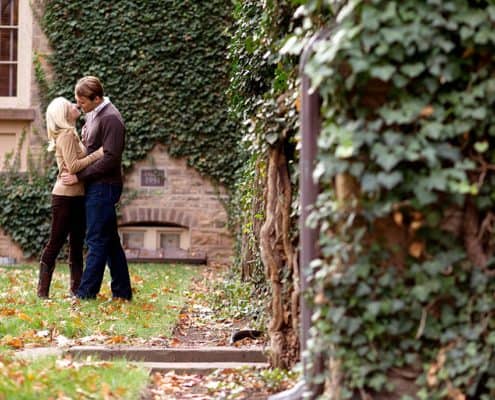 Fall engagement portrait with ivy covered stone walls, taken at Princeton University