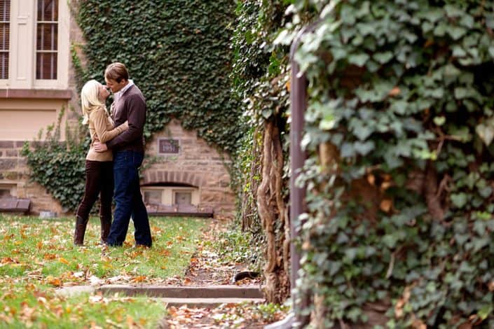 Fall engagement portrait with ivy covered stone walls, taken at Princeton University