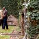 Fall engagement portrait with ivy covered stone walls, taken at Princeton University