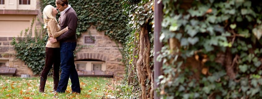 Fall engagement portrait with ivy covered stone walls, taken at Princeton University