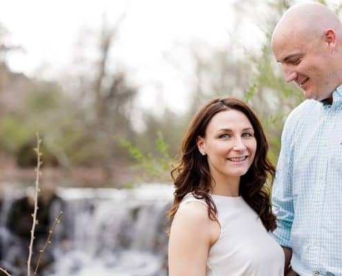 Engagement portrait with waterfall in the background, April photo shoot at Duke Farms in Hillsborough NJ