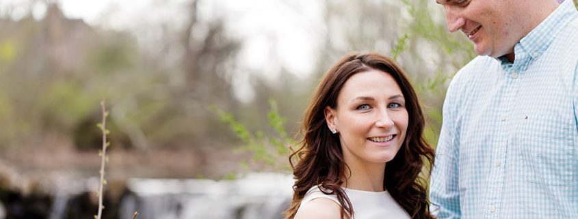 Engagement portrait with waterfall in the background, April photo shoot at Duke Farms in Hillsborough NJ