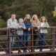 New Jersey family photography session outdoors, family posed on bridge, natural relaxed candid family photos