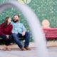Brooklyn engagement photo - couple sitting on park bench and chatting