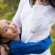 Mother daughter hugging in the park. Family portraits. Relaxed, candid New Jersey family photography.