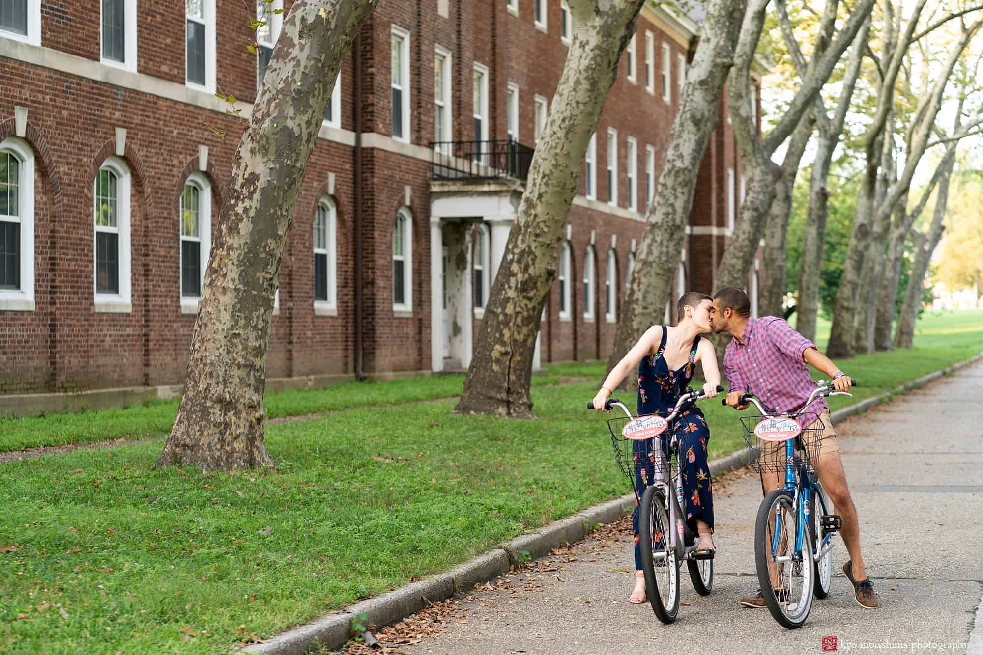 governors island engagement portrait photo cycling bike velo couple engaged nyc fun smile skyscraper city
