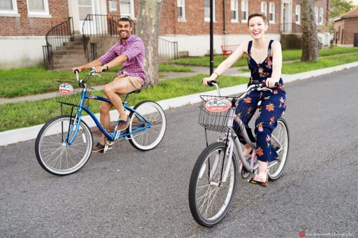 governors island engagement photo cycling bike velo couple engaged nyc fun smile skyscraper city