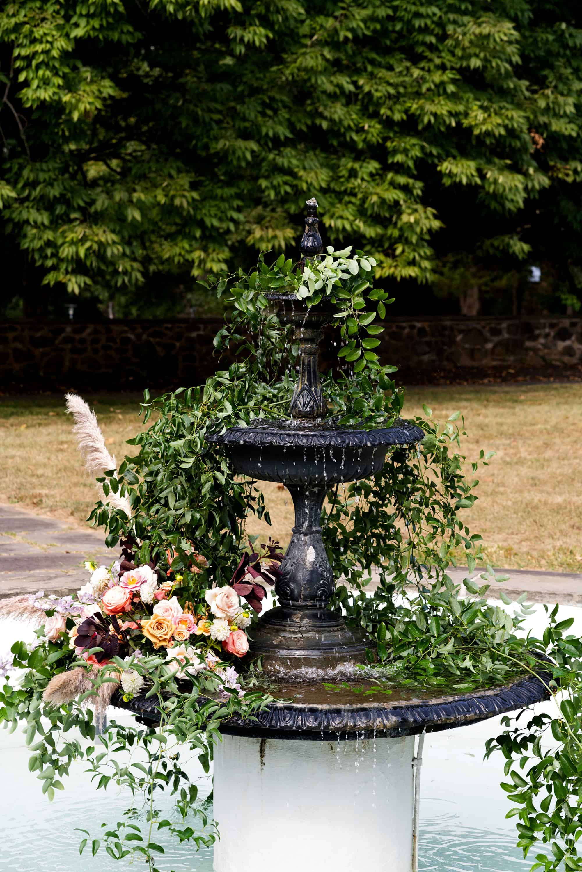 decor table set up Manor House Wedding decor set up princeton nj adams rental table decore flower plated chaires table reception outside fountain court yard outdoor ceremony flowers