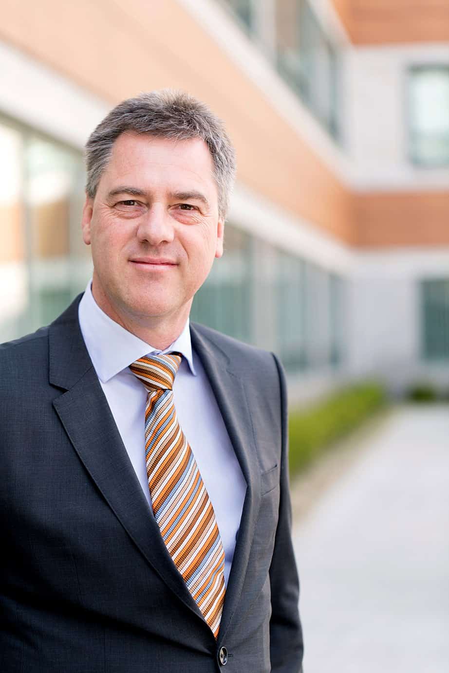 Outdoor corporate headshot in New Jersey NYC with natural feel