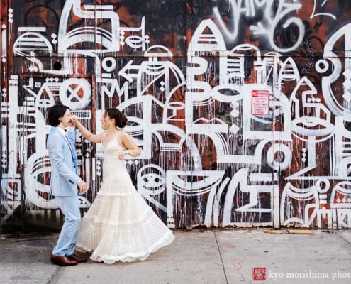 bride and groom dance twirl on the street Roberta’s Pizza Florals restaurant Williamsburg, Brooklyn wedding, graffiti