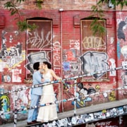 bride and groom, the street Roberta’s Pizza, graffiti, kiss, restaurant Williamsburg, Brooklyn wedding