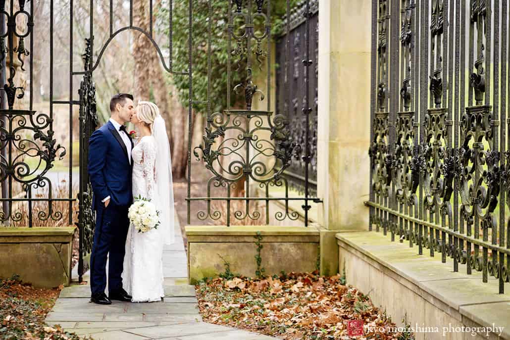 Jasna Polana princeton nj winter bride groom portrait wedding walking gate kiss