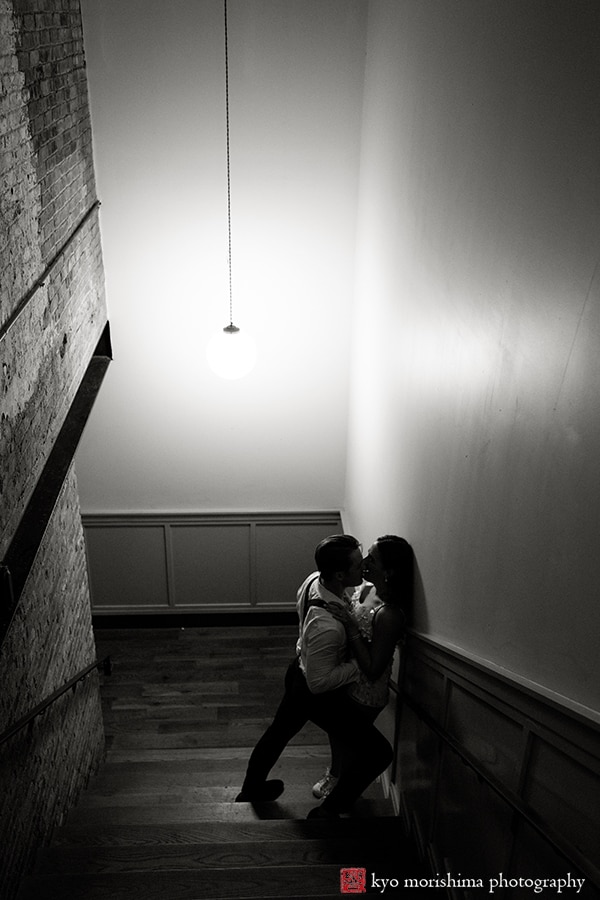 Wythe Hotel wedding brooklyn NYC Williamsburg reception bride and groom kiss stairway black and white