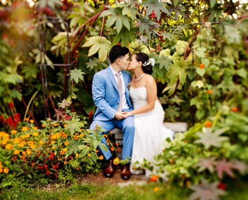Queens Botanical Garden Chinese wedding bride and groom kiss NYC outdoor portrait summer