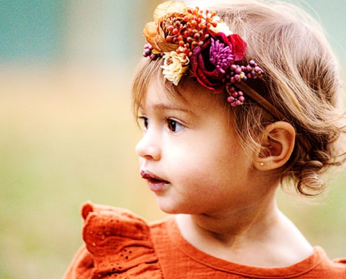 toddler girl red dress flower crown gazing far Princeton NJ autumn family portrait